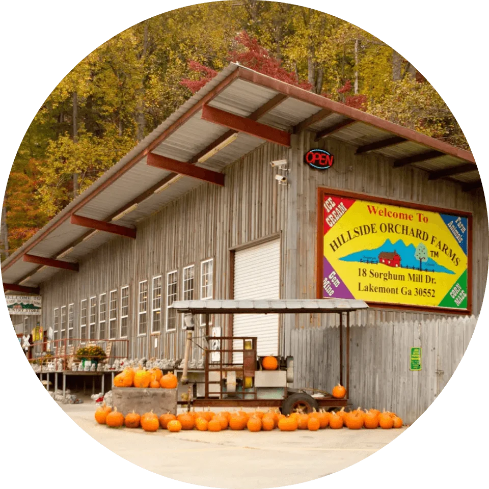Hillside Orchard Farm retail stand with seasonal pumpkin display