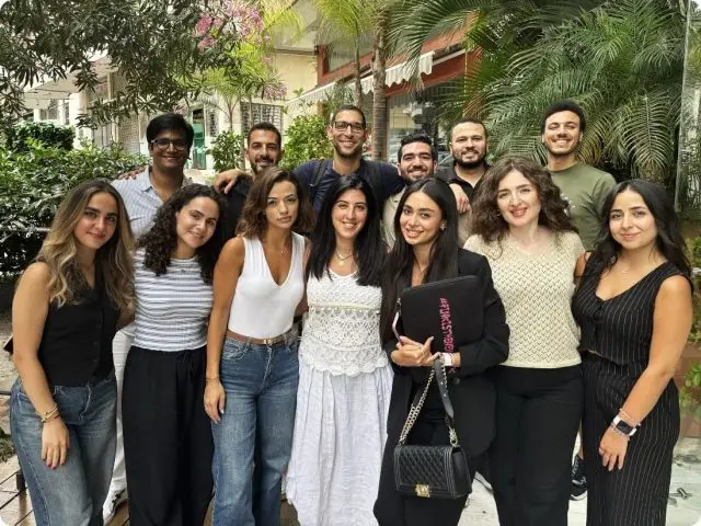 Team photo of the Food Label Maker company showing a diverse group of professionals behind the AI-powered nutrition and supplement labeling software platform.