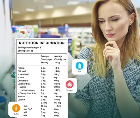 Food manufacturer reviewing a product label in a grocery store while a nutrition information panel and allergen indicators for milk, tree nuts, and gluten highlight ingredient and compliance analysis.